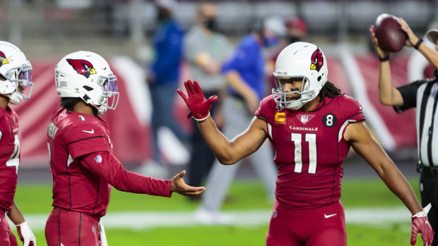 Arizona Cardinals quarterback Kyler Murray (1) celebrates Wirth wide receiver Larry Fitzgerald (11) after defeating the Buffalo Bills at State Farm Stadium.